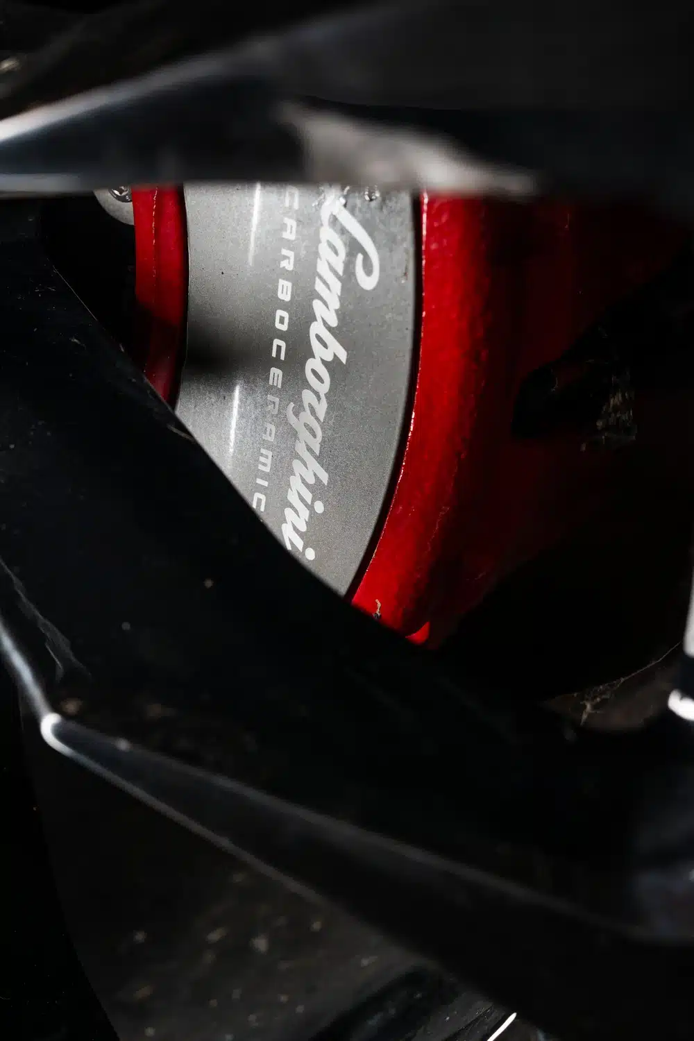 Extreme close up of the brake calipers and discs of a 2021 Lamborghini Urus V8 Auto