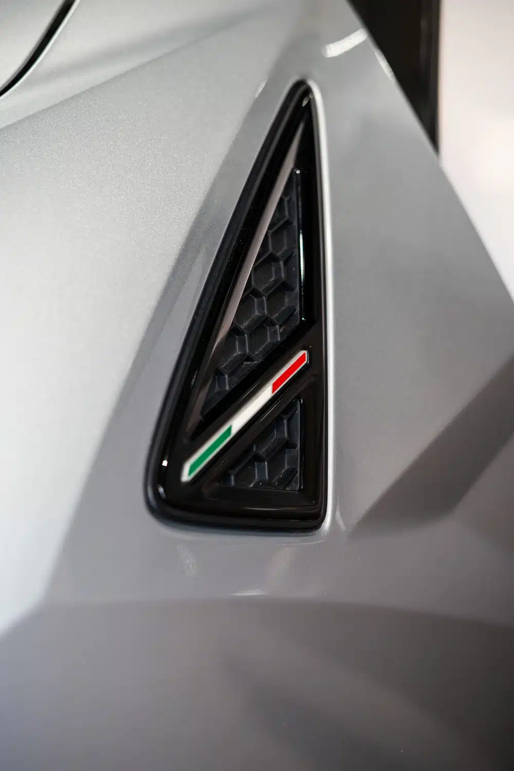 Close up photo of an Italian Flag detail adorning an air intake of a 2021 Lamborghini Urus V8 Auto
